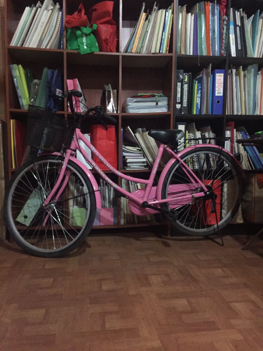 frae_v's tweet photo. My mom's bike parked in the office. Wanna take a ride but too hot pink for me lulz #thisisnotjapan #peoplewillraisetheirbrows #pwe https://t.co/hzi3G9yQNi