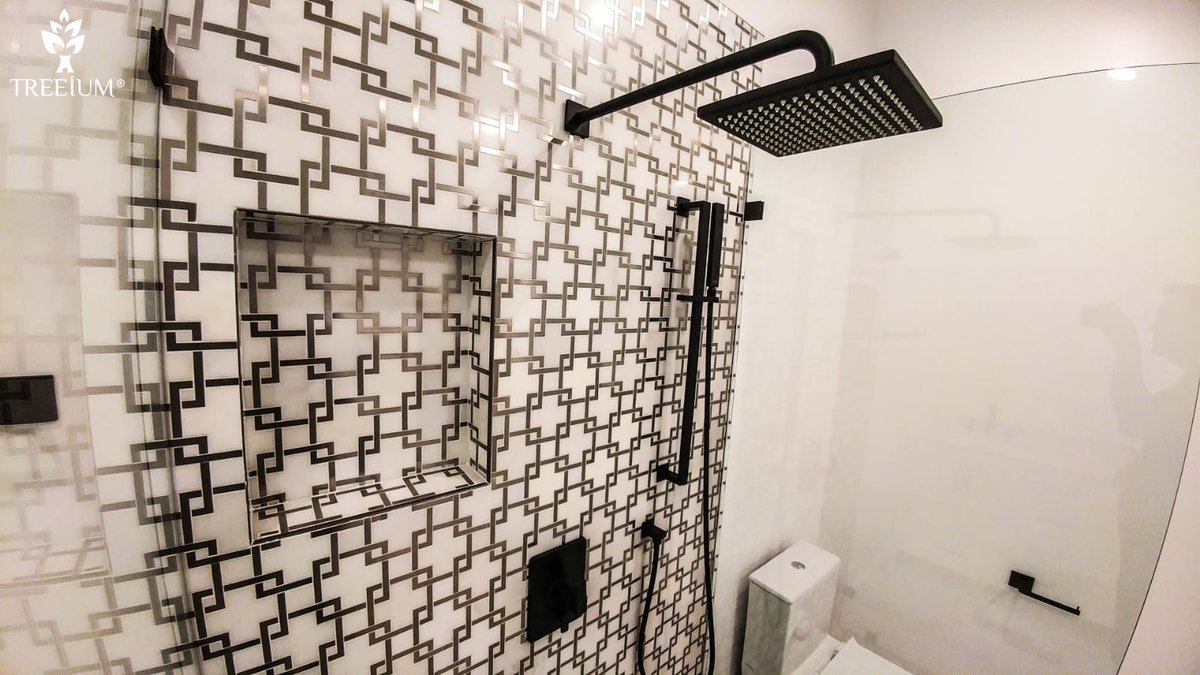Treeium's tweet image. Beautiful Carrara marble covered floors with bold black-and-white tiles that cover the floor and feature wall of the walk-in shower are what gives this sleek space a bolt of energy. #designandbuilt #treeium