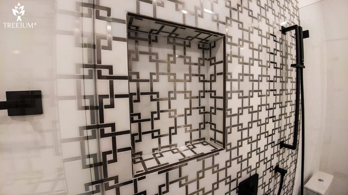 Treeium's tweet image. Beautiful Carrara marble covered floors with bold black-and-white tiles that cover the floor and feature wall of the walk-in shower are what gives this sleek space a bolt of energy. #designandbuilt #treeium