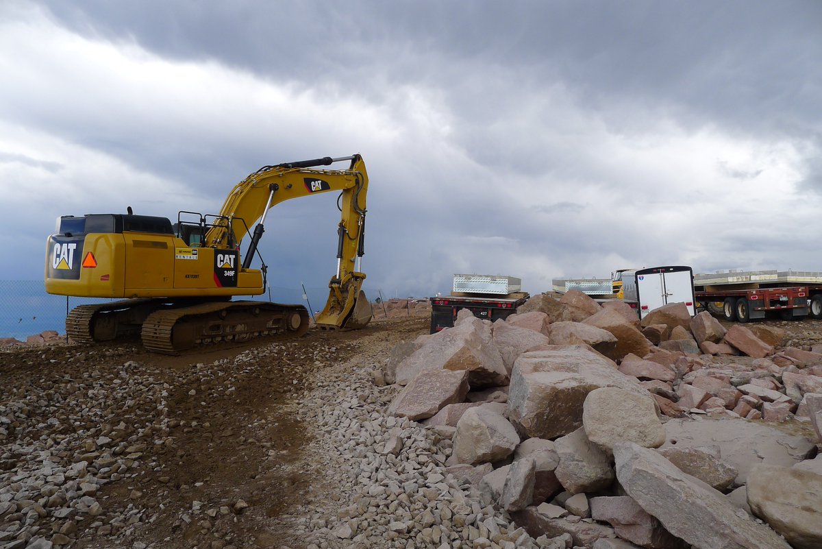 DHM_Design's tweet photo. Construction of the new #PikesPeakSummit complex is back in action. We're coordinating w/ @gejcc and Lyons Sandstone to get pavers cut from granite boulders on site. Thanks to the hard working logistics team, the mountain remains open to the public. @drivepikespeak https://t.co/RTTpBSdYSZ