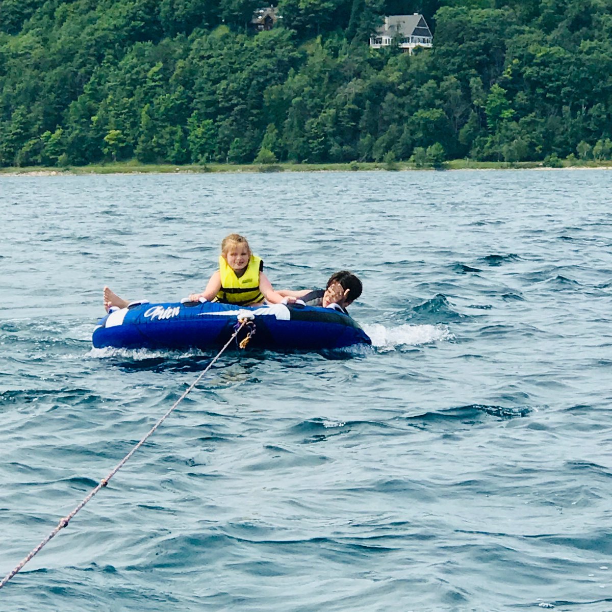Vivi and Jonah up north tubing at Crystal Lake!