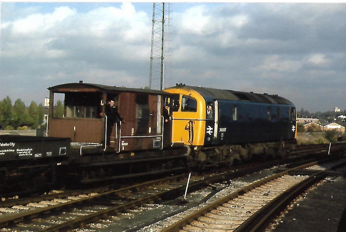 SalopianLyne's tweet photo. British Rail Class 74 Electro-Diesel 74 007 rebuilt from Electric E5003 at Crewe in 1968. Shunting Brake Van B951619 + Waterloo &amp; City Stock Medfit Match Wagons at Wimbledon East 5/11/77. Withdrawn 12/77 &amp; scrapped 1978 at Birds, Long Marston #BritishRail #Class74 #trainspotting https://t.co/pKHJLecyfO