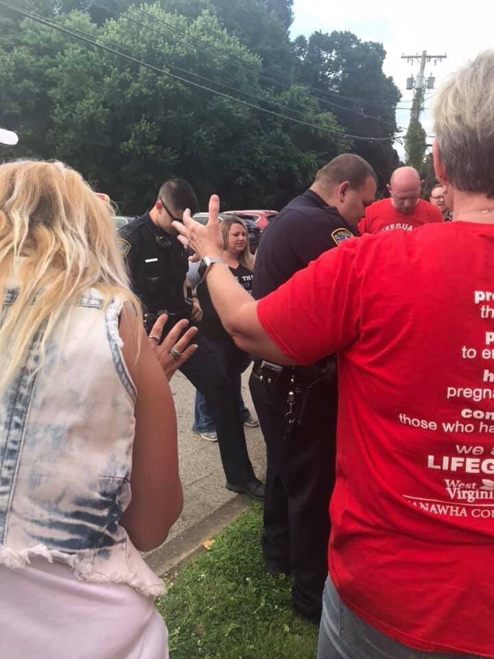 Nothing special today. Just members of the <a href="/CharlestonPDWV/">Charleston Police Dept</a> praying alongside anti-choice protesters to support the closing of the state’s last abortion clinic.