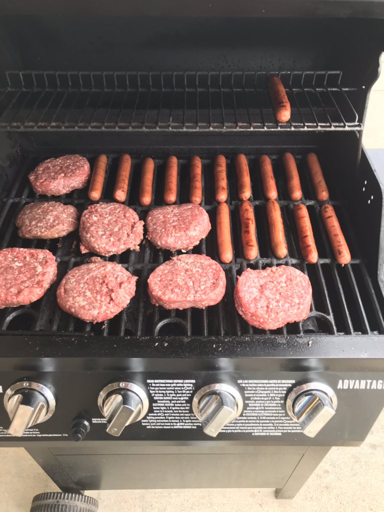 Throwing some burgers and dogs on the grill at York High School. Pride Baseball!
