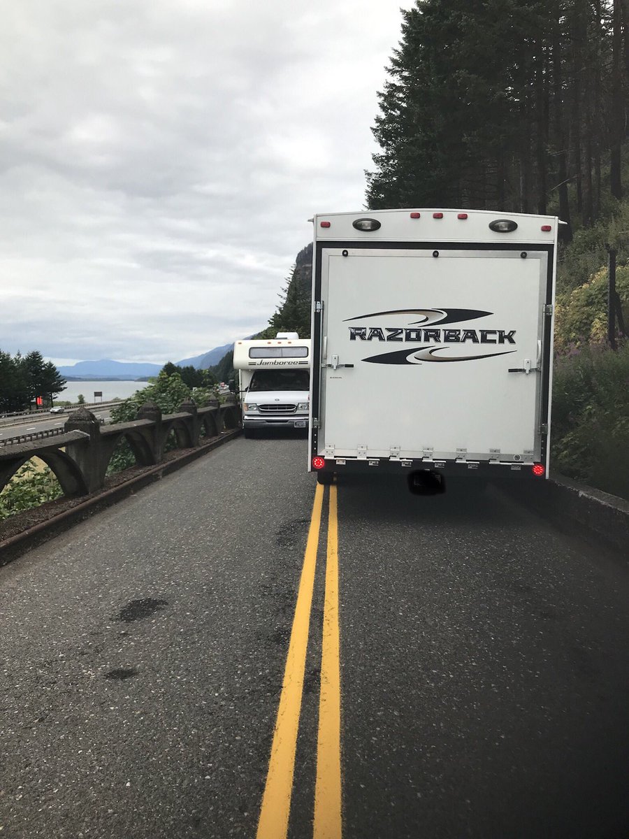 MultCoSO's tweet image. Please remember that oversized vehicles will not fit on Columbia River Hwy between Vista House and Ainsworth Campground. A deputy had to help these two vehicles pass each other just east of Multnomah Falls, causing a long backup. #OldHwyDoesntLikeLargeVehicles