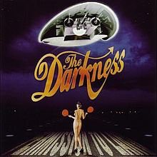 thedarkness's tweet photo. Happy sweet sixteen to the one that started it all. ‘Permission to Land’, 16 years young today. Album seven ‘Easter is Cancelled’ set for release this October is available to pre-order now at https://t.co/kKfUH5ixO8 🎂 https://t.co/zO2d4WWx5G