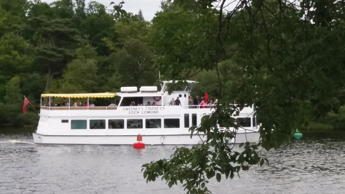 One of tne cruises you can take on lochlomond pulling into dock