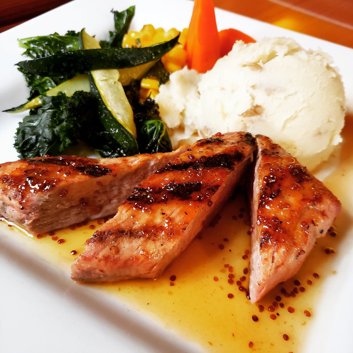 Honey Dijon Pork Tenderloin on of three delicious entree choices from our $20 three course menu. Juicy grilled pork brushed with honey &amp; dijon mustard glaze. Served with mashed potatoes &amp; veggies. 
#HomeAwayFromHome #yyj #victoriabc #yyjfood