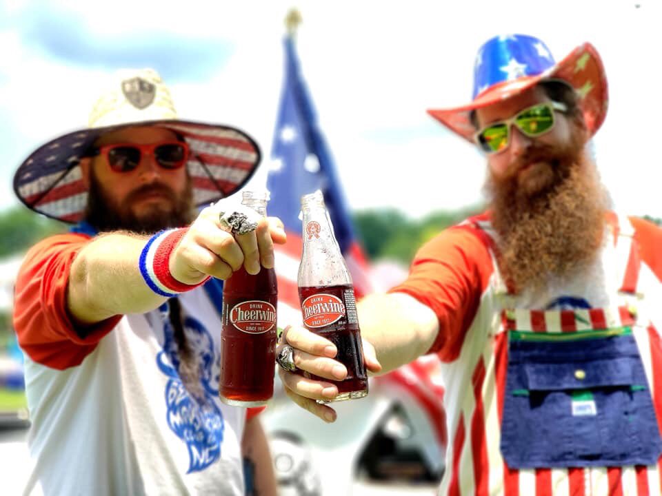 CLTSaltyBeard's tweet photo. This past July 4th Greg &amp; Brian from @BMCofNC having a @DrinkCheerwine at @HGrove_parade. 🇺🇸🥤 https://t.co/24bM2ve0eI
