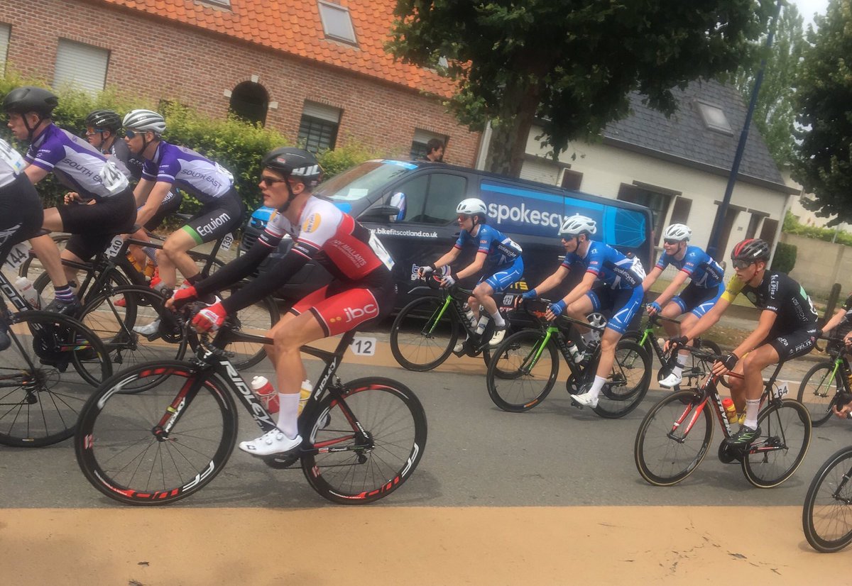 First lap of the race and is that smiles we see from the Spokes boys? Bunch altogether...