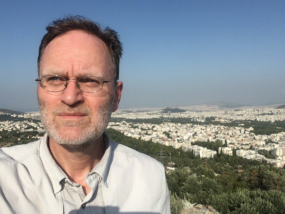 wntn_historians's tweet photo. Professor Samons is in Athens doing work for the American College of Greece and making sure the Philhellenes Summer Study gets off to a good start.

Here’s a view of Athens from Hymettos, with the distant Acropolis and Parthenon just to the right of Professor Samons’ left earlobe https://t.co/LNgNwG7pyp