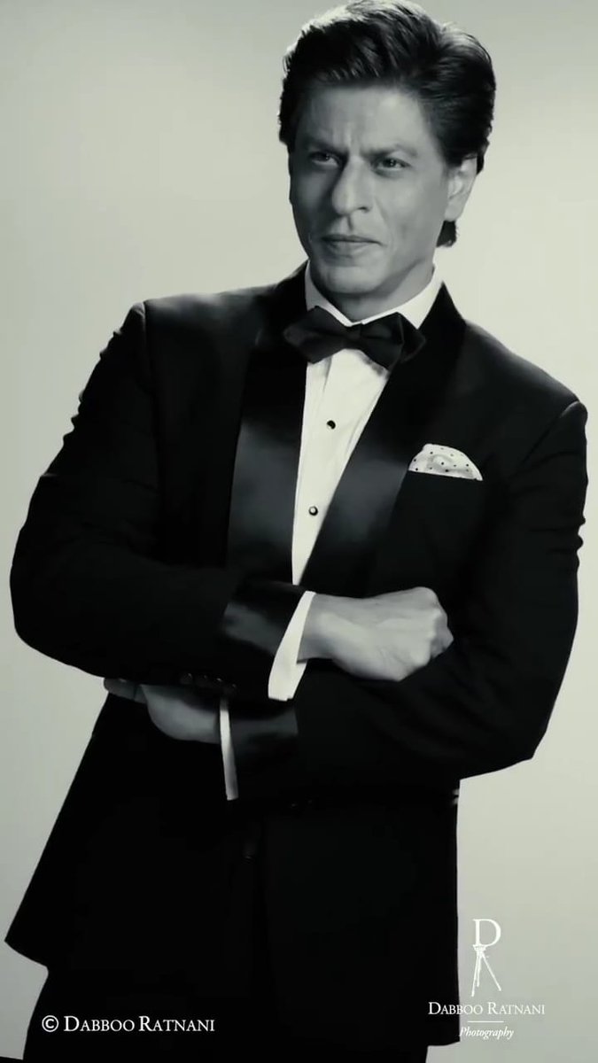 TeamSRKWarriors's tweet photo. Dapper, elegant &amp; stylish all at once, #BTS photoshoot of @iamsrk with @DabbooRatnani 🔥 https://t.co/nKqUJg7A3E
