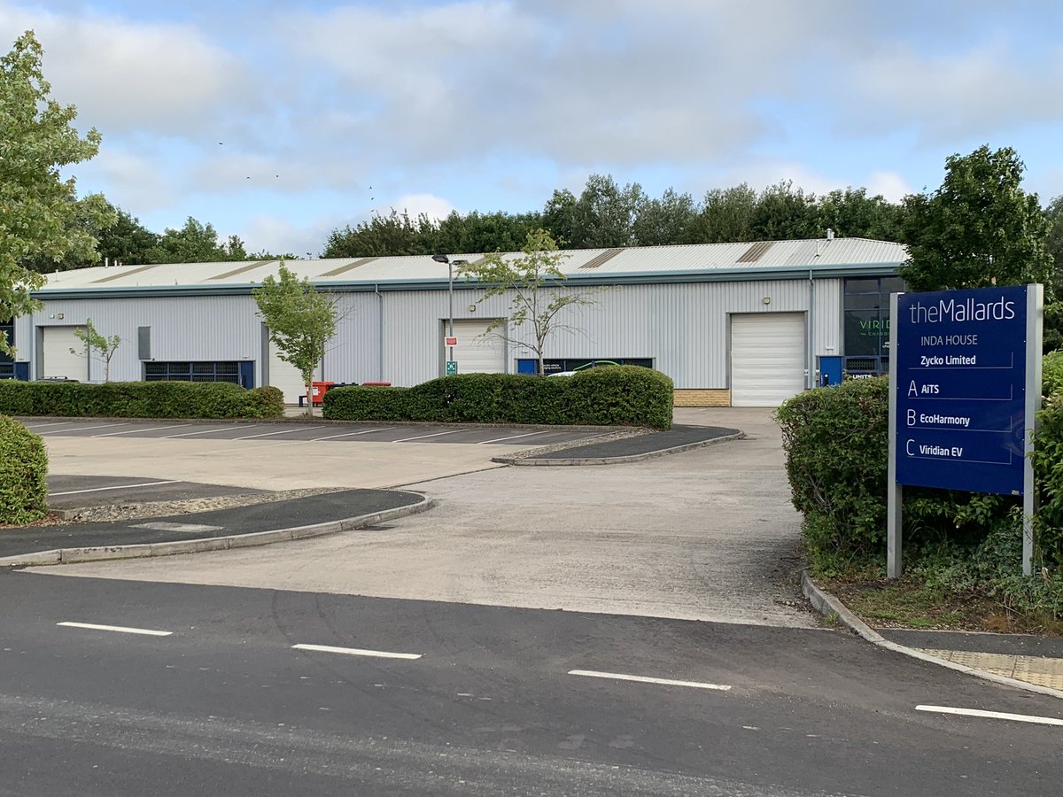 The entrance to the new unit, sign board up and 20 parking spaces
