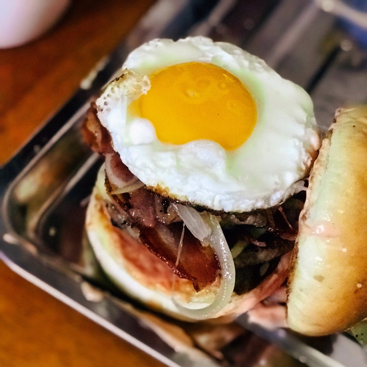 chrisnaadinatha's tweet photo. In-N-Out Colossus Burger has a well-known our signature @tribeburger . Double cheese patty w/bacon, tribe pickels plus grilled onions and sunny side up! joon... reputation as a corporation that is operated with a message and philosophy.🍔
#colossusburger #tribeburger #burgertribe https://t.co/N6h7hRu7MH