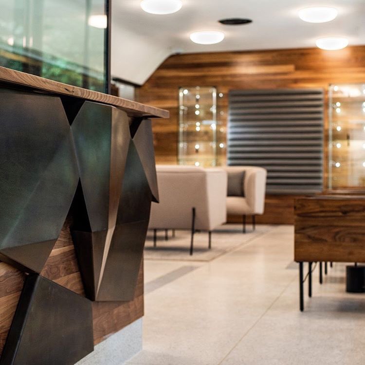 Detail shot of a blackened steel reception desk in collaboration with <a href="/nano_llc/">NANO LLC</a> #beardedweldersofinstagram  #blackenedsteel #geometric #modern #interiordesign #metalfabrication #custom #handmade #receptiondesk #unique #metalandwood #3dart