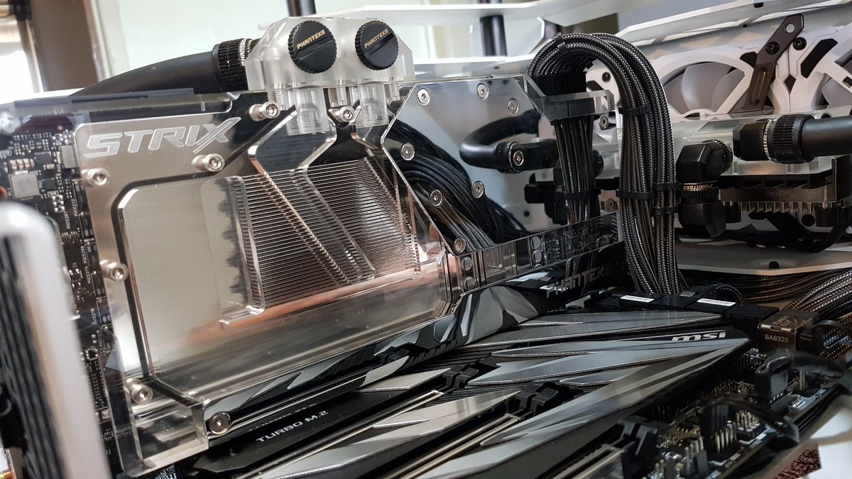 GPU block installed and LED lighting connected up. Unicorn vomit FTW
<a href="/antec/">Antec</a> <a href="/Phanteks/">Phanteks</a> <a href="/ROGNordic/">ASUS ROG Nordic</a> <a href="/CableMod/">CableMod</a>