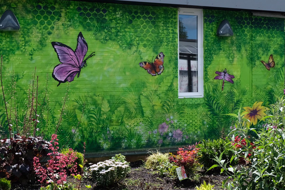 GHSArtdept's tweet photo. Unveiling of our completed wall mural @RedburnSchool memorial 'butterfly' garden this morning. The garden is looking fantastic. Everyone in the Art dept has enjoyed being involved in this project and it's been a pleasure to meet all the staff and pupils at @RedburnSchool 🙂 https://t.co/qOak2rE1Is