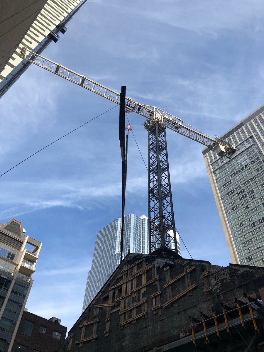 dgtroop's tweet photo. On cue, new steel truss being lifted into place. This will replace 1894 steel - 125 years of faithful service but time to increase load capacity. #ellisdon #masseyhallforever @masseyhall https://t.co/iFH51wKemz