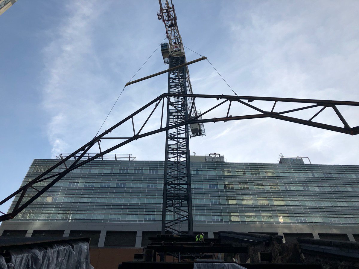 dgtroop's tweet photo. On cue, new steel truss being lifted into place. This will replace 1894 steel - 125 years of faithful service but time to increase load capacity. #ellisdon #masseyhallforever @masseyhall https://t.co/iFH51wKemz