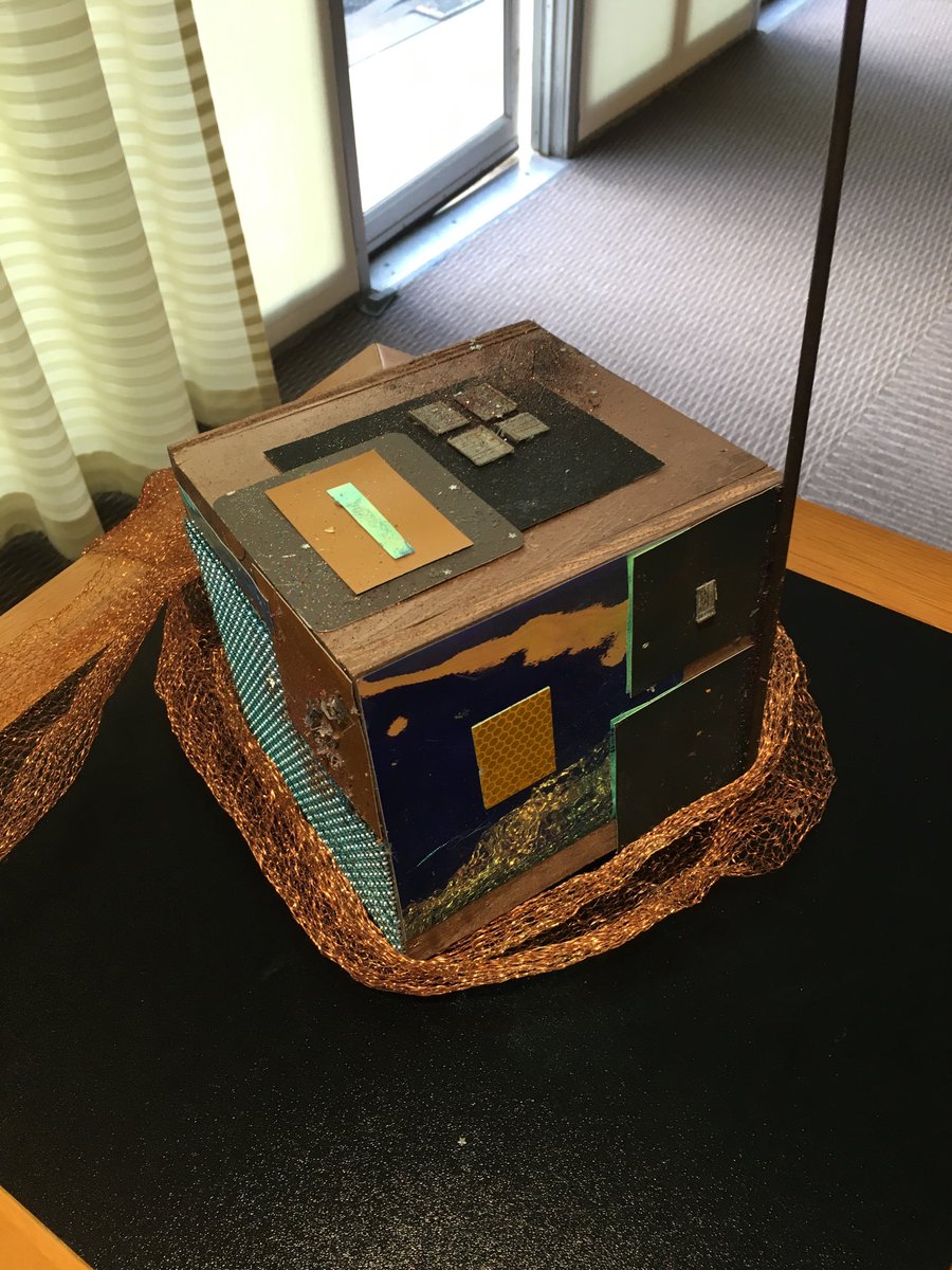 jeff_foust's tweet photo. Ersatz cubesats on display at #SpaceEntSummit; the glitter is an interesting touch. https://t.co/4pAcsdvhim
