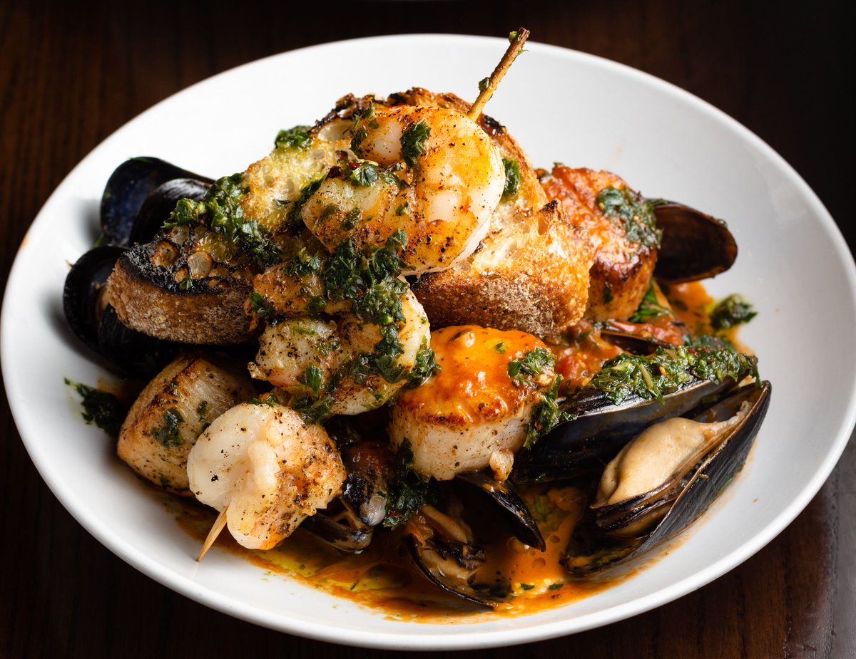 A sensational arrangement of summer seafood! Our Frutti di Mare features Scallops, Mussels, Shrimp Spiedino, topped with Bruschetta and Salsa Verde.