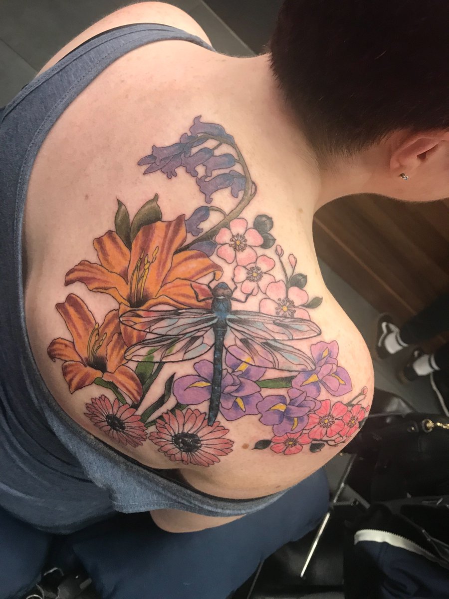Blithe10's tweet photo. So, on Tuesday I finally got my tattoo. Paul @DevilsOwnTattoo took my dragonfly with many flowers idea and smashed it out of the park with this beauty. I could not love it more! Thank you Paul and thank you my flowers - you know who you are! ❤️ https://t.co/qXbJzX2Cex