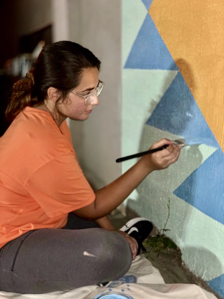 emmaline_austin's tweet photo. I just completed my life long dream of painting a mural in my hometown Pembroke, NC. This doesn’t even feel real. Like, this really just happened. https://t.co/xeduRlbC9V