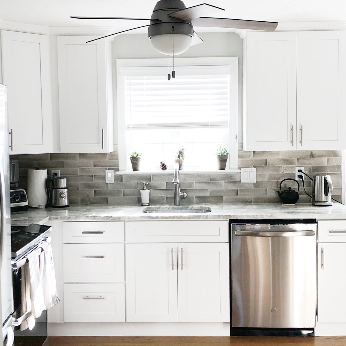 brickbeamstudio's tweet photo. We love the way our client's kitchen renovation came out! We kept it feeling cool and neutral with the granite countertops and complimentary backsplash. The natural light in this room is everyone's kitchen goals. https://t.co/35Q7jaChft