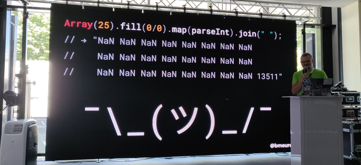 @bmeurer on stage of @workerconf talking about the odd parts of JavaScript. Revealing, what result Array(25).fill(0/0).map(parseInt).join(" "); gives. Basically a bunch of NaNs and the number "13511" in the end.
On the bottom is the shrug emoji.