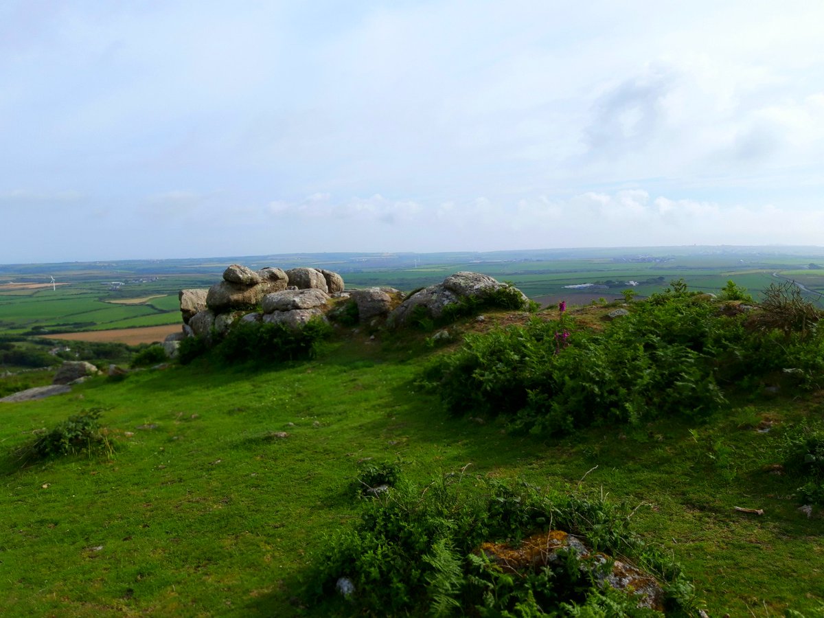 Chapel Carn Brea, the first and last hill in mainland Britain, has a Neolithic entrance grave under the remains of a medieval chapel, cairns and hut circles. Views as far as The Lizard in one direction, The Isles of Scilly in the other. More ...  #PrehistoryOfPenwith