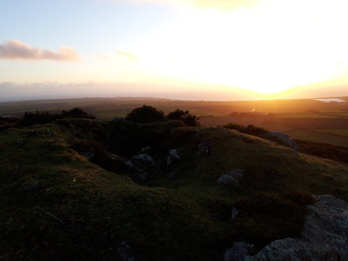 Chapel Carn Brea, the first and last hill in mainland Britain, has a Neolithic entrance grave under the remains of a medieval chapel, cairns and hut circles. Views as far as The Lizard in one direction, The Isles of Scilly in the other. More ...  #PrehistoryOfPenwith