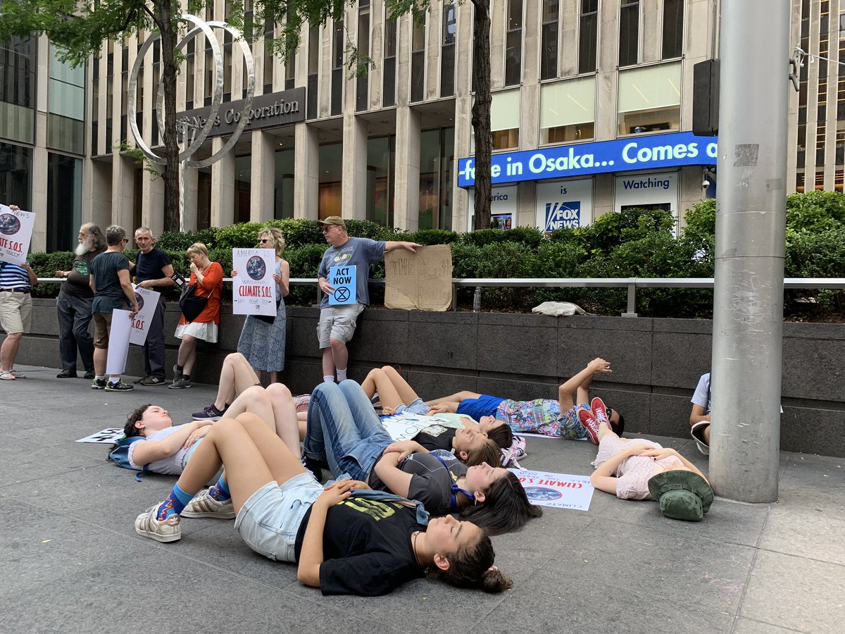GregSchwedock's tweet photo. #EarthToMedia: youth die-in front of @FoxNews chanting, "The Earth is dying, stop denying" #FridaysForFurture @Earth_Uprising https://t.co/37iFLm6Tx7