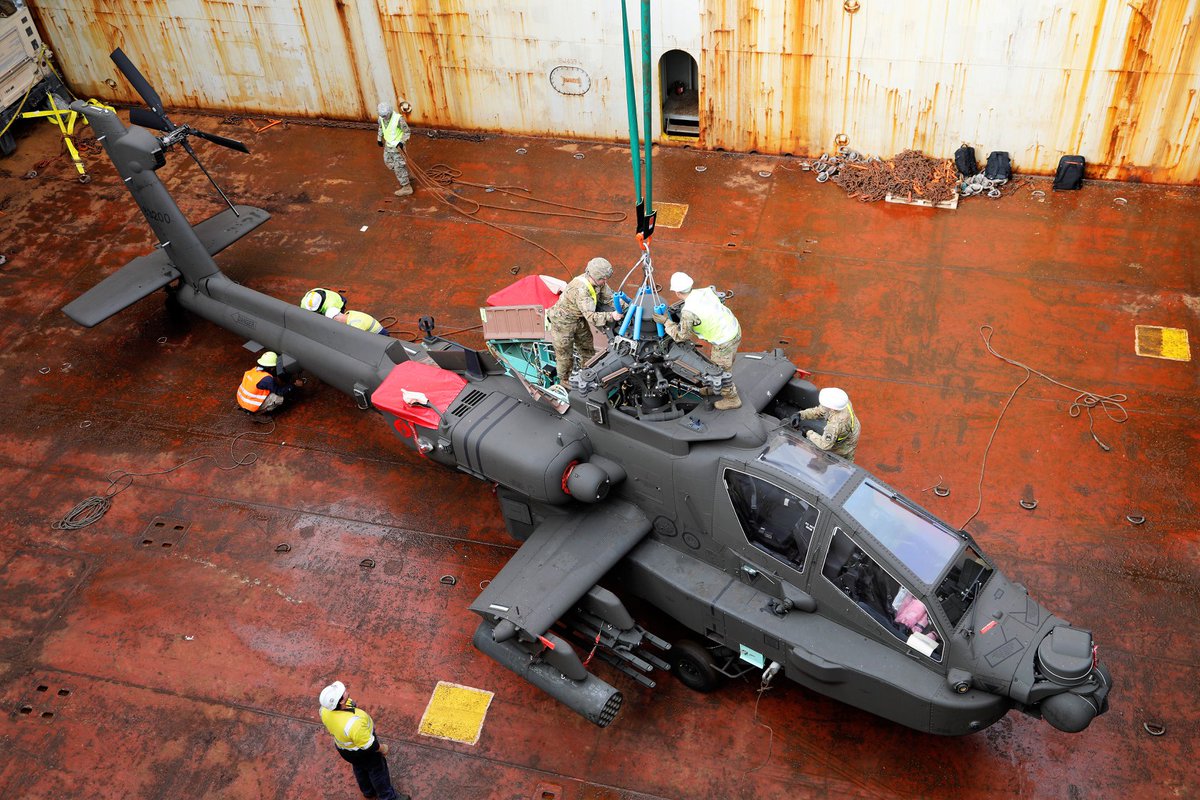 U.S. Army Soldiers with the10th Support Group and their Australian counterparts work together off-loading military equipment during port operations, June 24-26 at an Australian port.