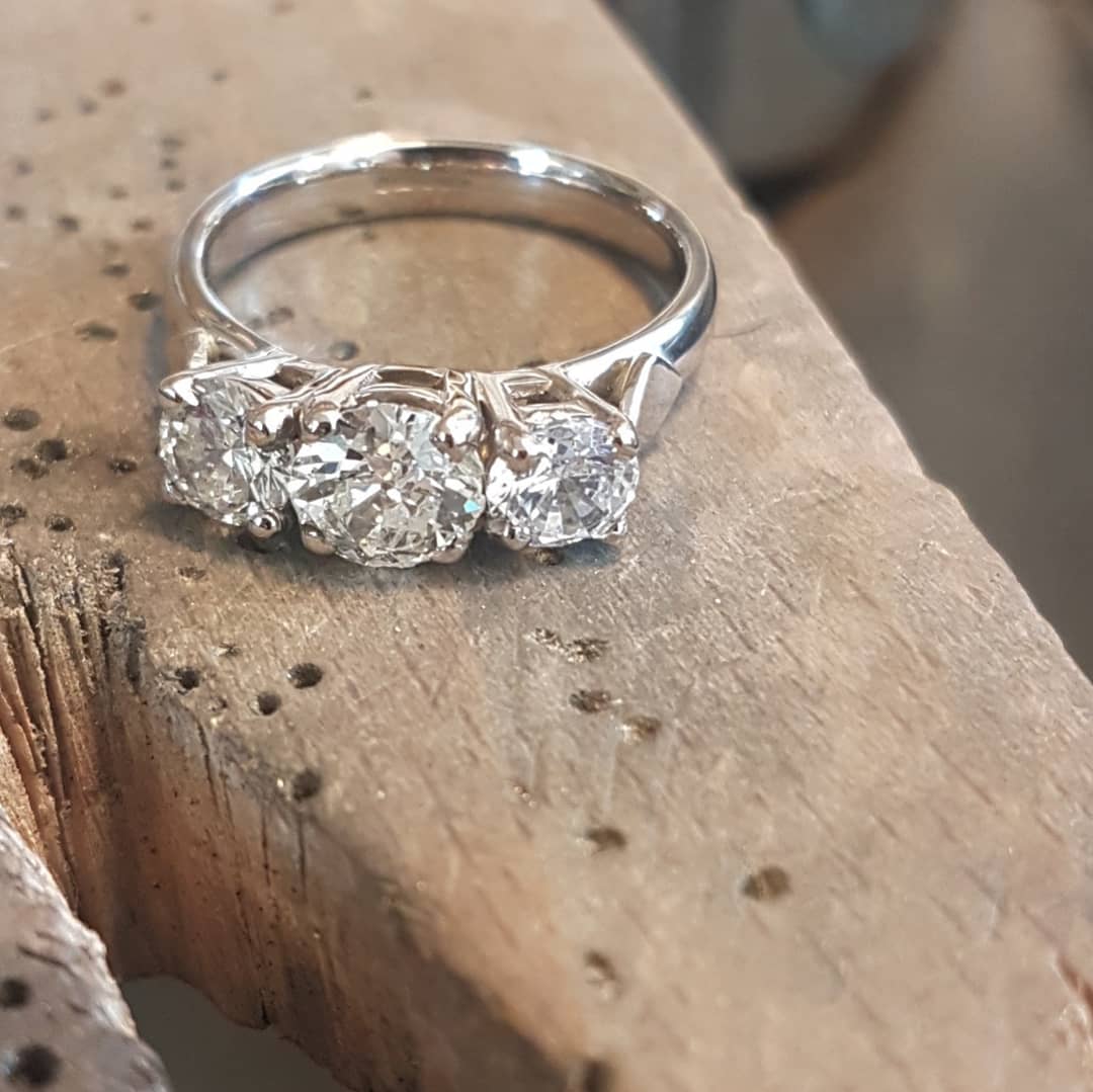 claireallain1's tweet photo. A spot of remodelling went back to its owner today..a mixture of her jewellert plus some heirloom diamonds and a sprinkle of new diamonds #18ctwhitegold #diamonds #europeancut #trilogyring #diamondweddingring #recycled #ethicaljewelry #handmade https://t.co/ryGRs6aRGu