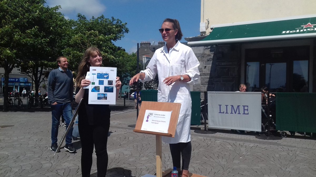 menudolio's tweet photo. Catherine Jordan educating us on how we monitor the Ocean from Space! She is being assisted by @PalaeoMegan and you can find them at Spanish Arch #Galway @SoapboxSciIRL #MorPalaeoLab https://t.co/8JmyH5mIyH