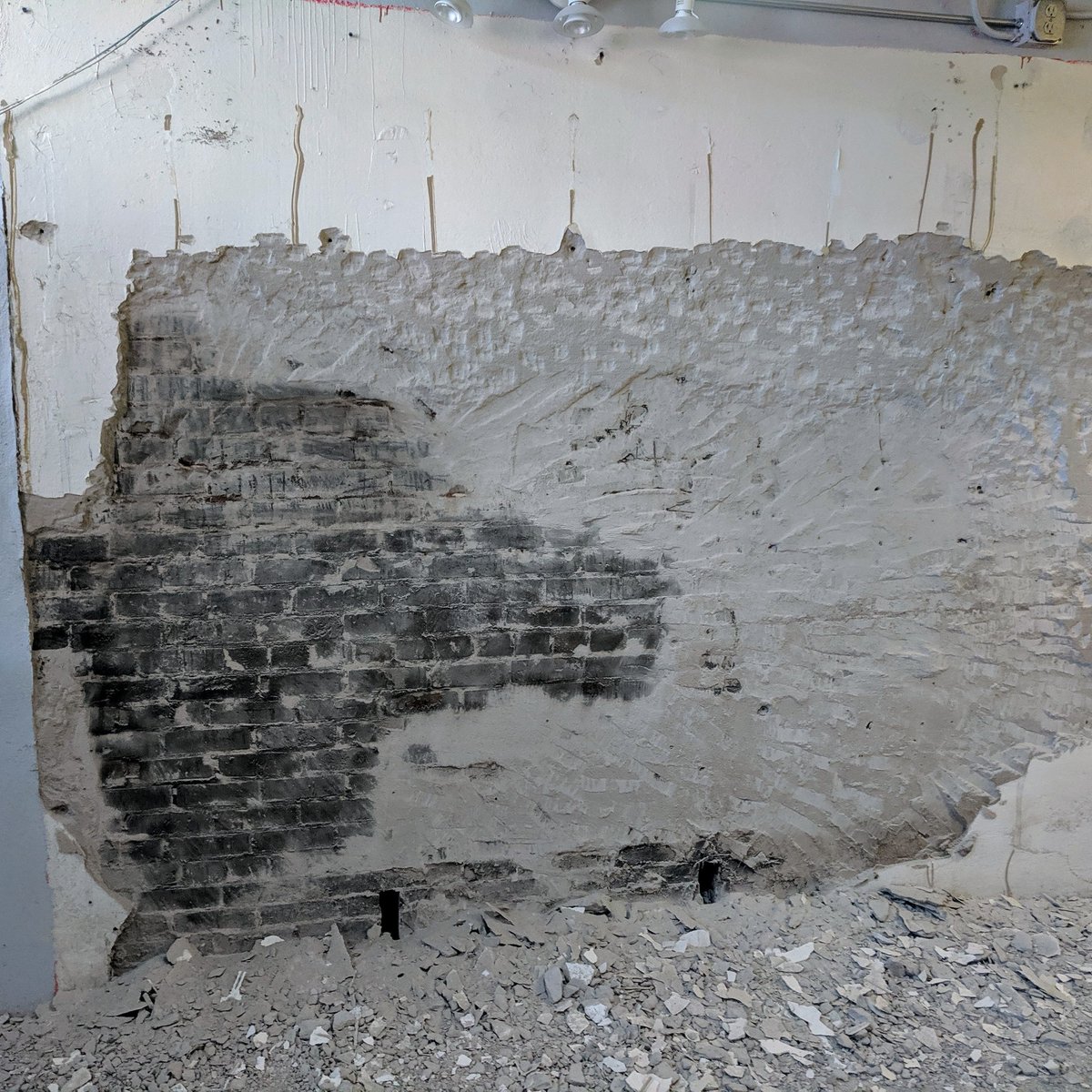 Restoring the interior walls to the original brick has begun! #YourTurn #demo #construction #brickwall #BoardGameCafe