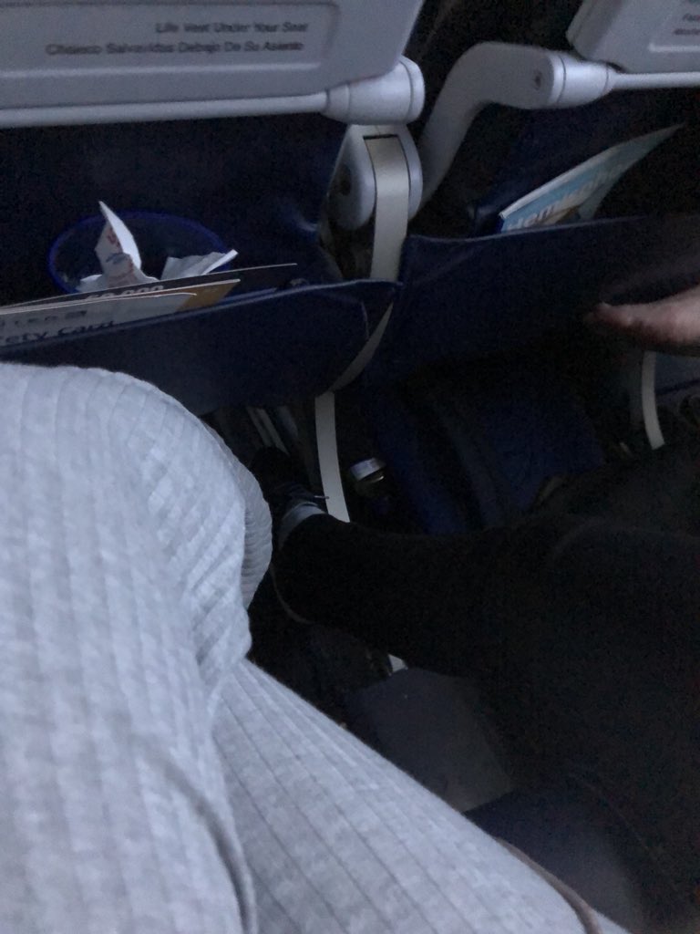 bellamabella's tweet photo. Another reason I wanted to upgrade my seat @united !!! I am now squished in my seat cause the woman next to me is laid out and her husband thinks this lack of foot ware is ok. It’s not ok https://t.co/n8xRo1iAtD