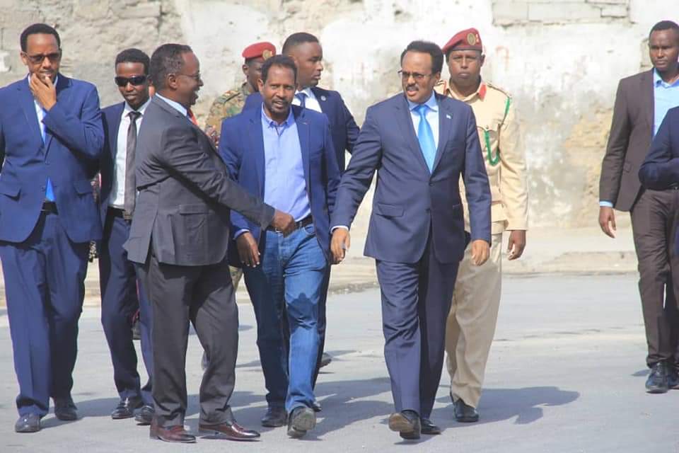 MOISOMALIA's tweet photo. H.E President @M_Farmaajo
cuts ribbon on newly constructed roads in #Shingani that has been officially named "Abwan Timacadde" as a tribute to the well known Somali poet Abdillahi Suldaan Mohammed who dedicated his life to Somalia &amp; Liido Road in Abdiaziz, #Mogadishu. #Somalia https://t.co/FvnqJh55hq