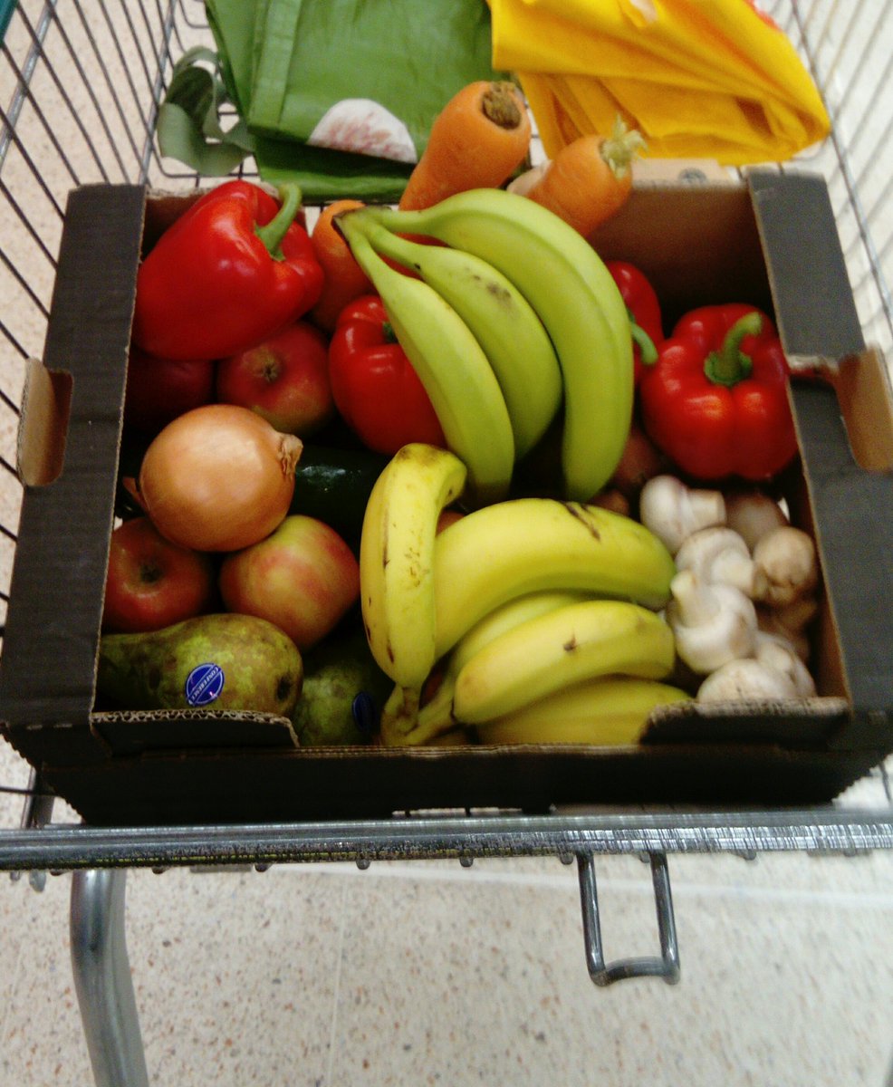 I use fruit and veg boxes from supermarkets to put my plastic free food in.

No plastic or paper bags required and it's much easier to load at the checkout.