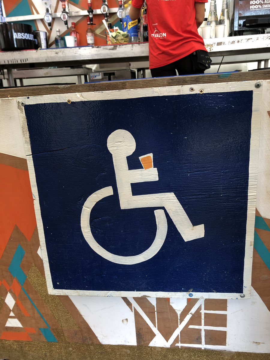 Wheelchair gal with wheelchair pint 🍺 so many lowered accessible bars at glasto, would love for this to be more of a thing in ‘real life’ too!