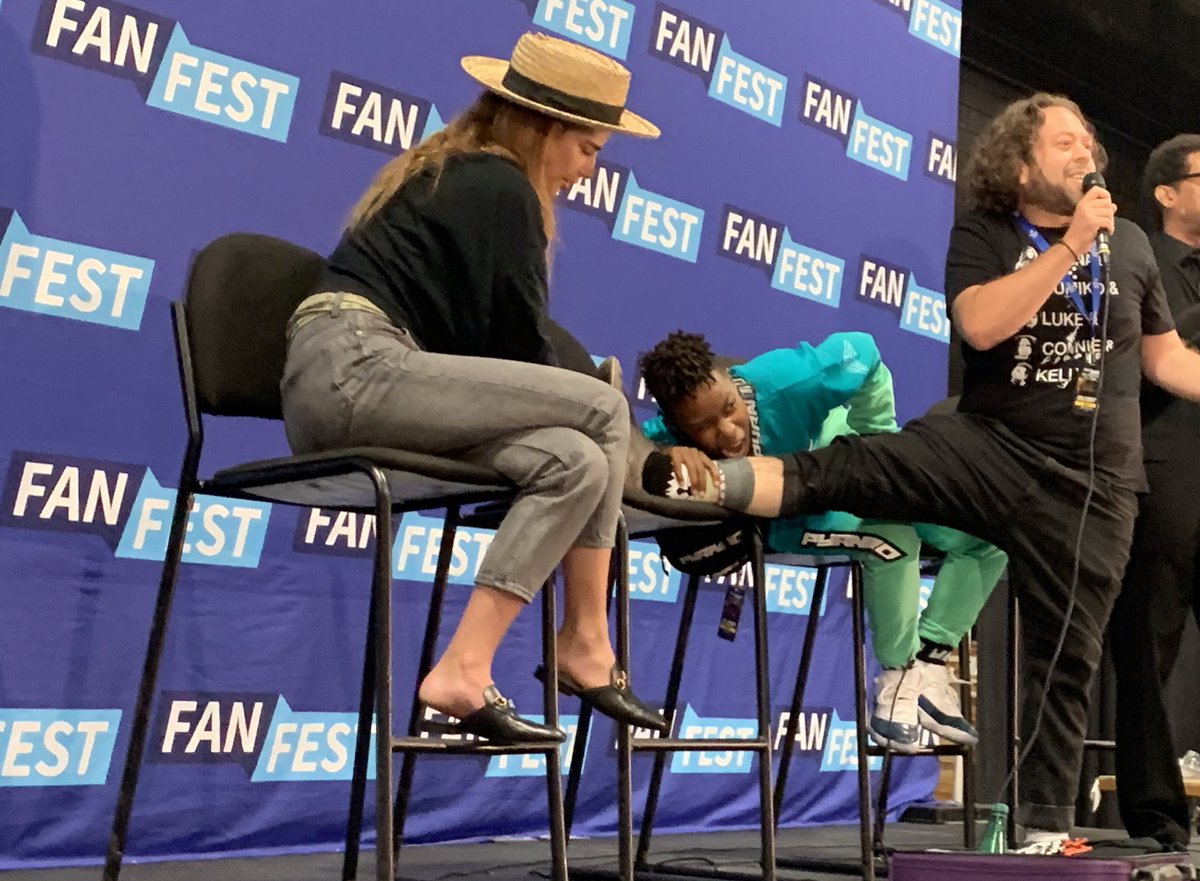 WalkrStalkrCon's tweet image. Too silly! @mrdanfogler shows off his zombie socks on stage!