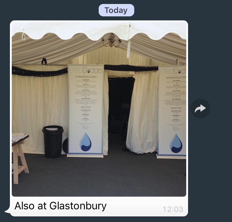 Screenshot of a WhatsApp message with a photo of a big tent at Glastonbury with posters up advertising Get A Drip’s services within.