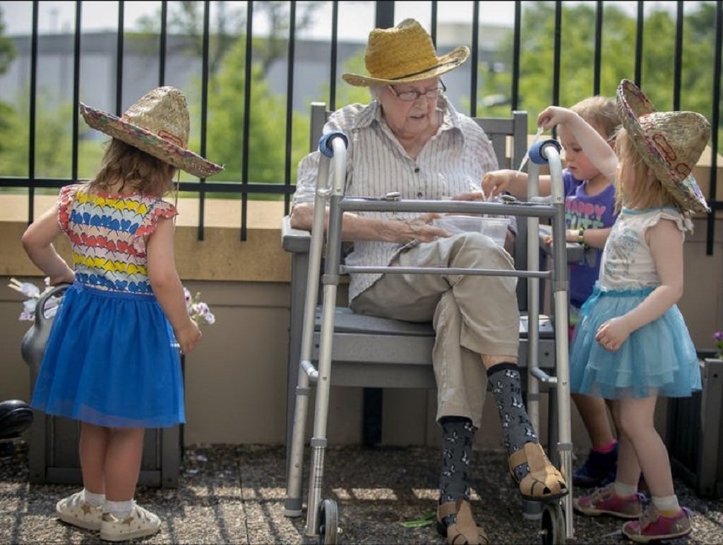 FairviewHealth's tweet photo. What do you get when you cross a day care center with senior living? Kids with grandfriends! Read about the joy of bringing generations together at our @EbenezerMN campuses https://t.co/9seLNuTMEq https://t.co/K7HaZmiEys