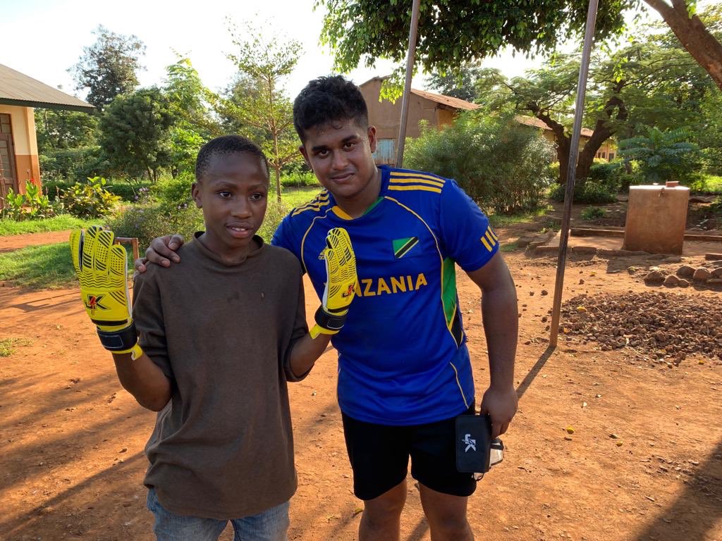 DESCtrips's tweet photo. Adam Lobo handing over the football gloves kindly donated by Jordan from Just 4 Keepers! 🏐 🥅 #just4keepers @DESCPE https://t.co/6PBTG26GDJ