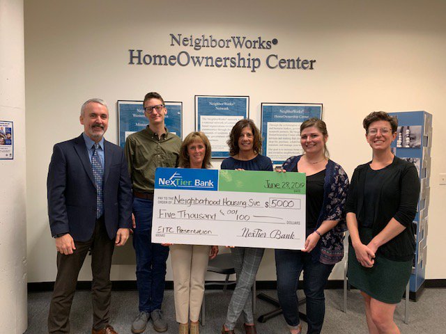 NexTier's tweet photo. The #travelingcheck is still out an about, and made a stop at NeighborWorks on Friday June 28th. For more info visit https://t.co/eir7TIgpjB Colin Kelley- CEO, Quinn Kobelak, Sue Kushneireit , Missy Crocker , Beci Russell Anne Schwan- Education Specialist. #Nextierbank #EITC https://t.co/tQAXi6IvcE