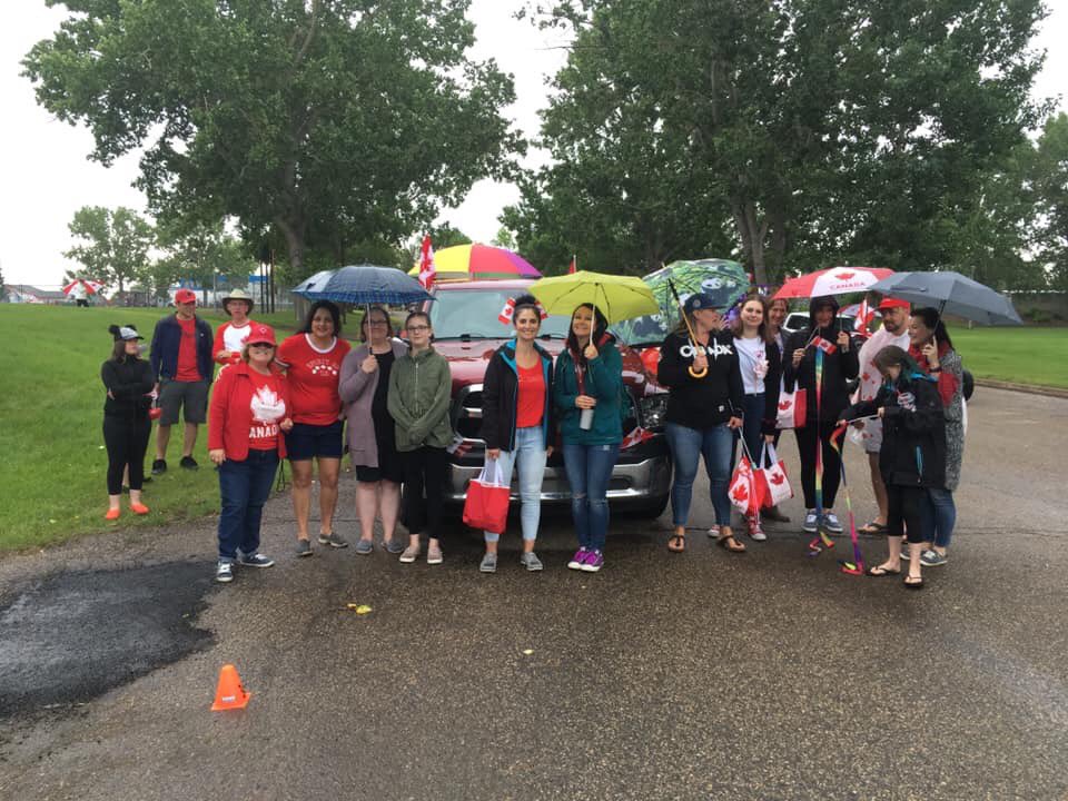 danceswflamingo's tweet photo. The FSE crew before partaking in the  Fort Saskatchewan Canada Day parade. We got wet but we had a lot of fun! @FortElementary @eips #fortsask #fortelementary #community https://t.co/BqFzVf7GUQ