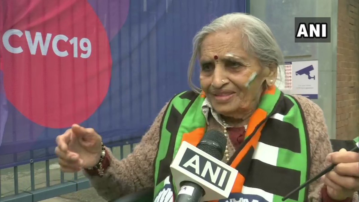 ANI's tweet photo. 87 year old Charulata Patel who was seen cheering for India in the stands during #BANvIND match: India will win the world cup I am sure. I pray to Lord Ganesha that India wins. I bless the team always. When Kapil paaji won the World Cup in 1983, I was there as well. #CWC19 https://t.co/Y35NmXmbCt
