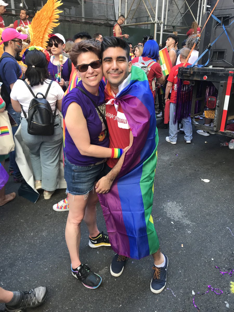 FanaticalFrog's tweet photo. We marched behind @IEquality #ImmigrationEquality and this beautiful individual asked to take a picture with my pride flag. I gave it to him &amp; He definitely wore it better! https://t.co/npLc7iMWAt