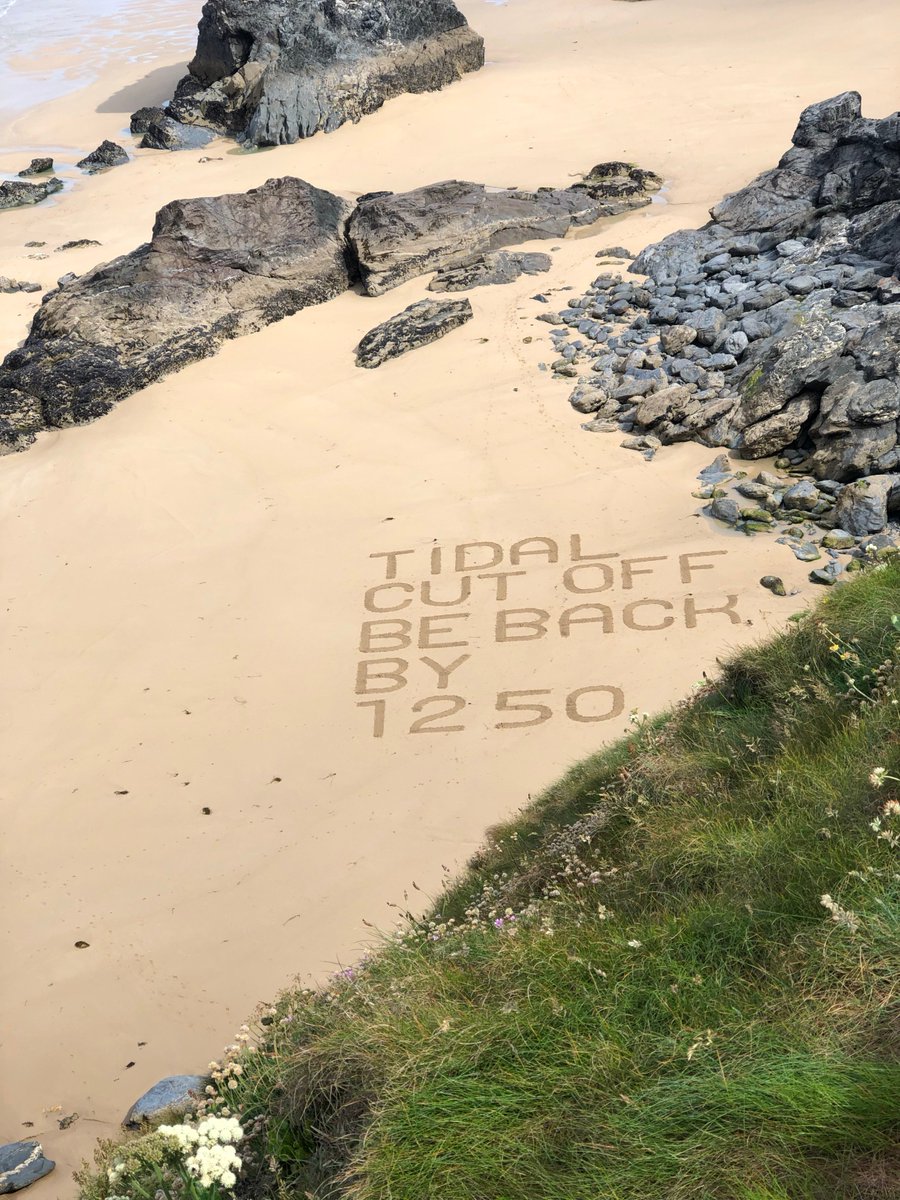 RNLI's tweet photo. The sand signage is also being used to highlight what time beach goers need to return before they get cut off by the tide. #SandSignage https://t.co/eOCS1BPTo0