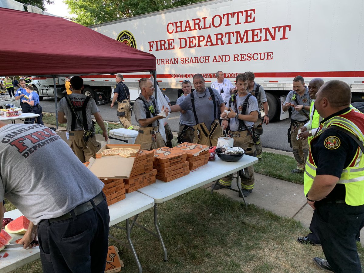 CharlotteFD's tweet photo. Update Structural Collapse; James Jack Ln; Big Thank You to the community! Firefighters are eating &amp; rehydrating during rehab while the search continues https://t.co/mXmFvEhogx